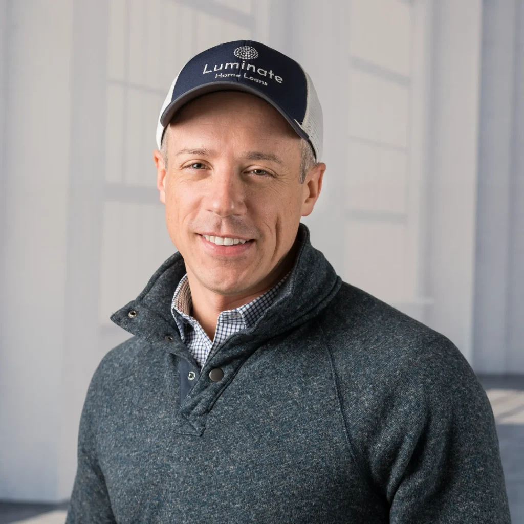 image of personal growth expert pointing to a whiteboard as he works with a group of clients